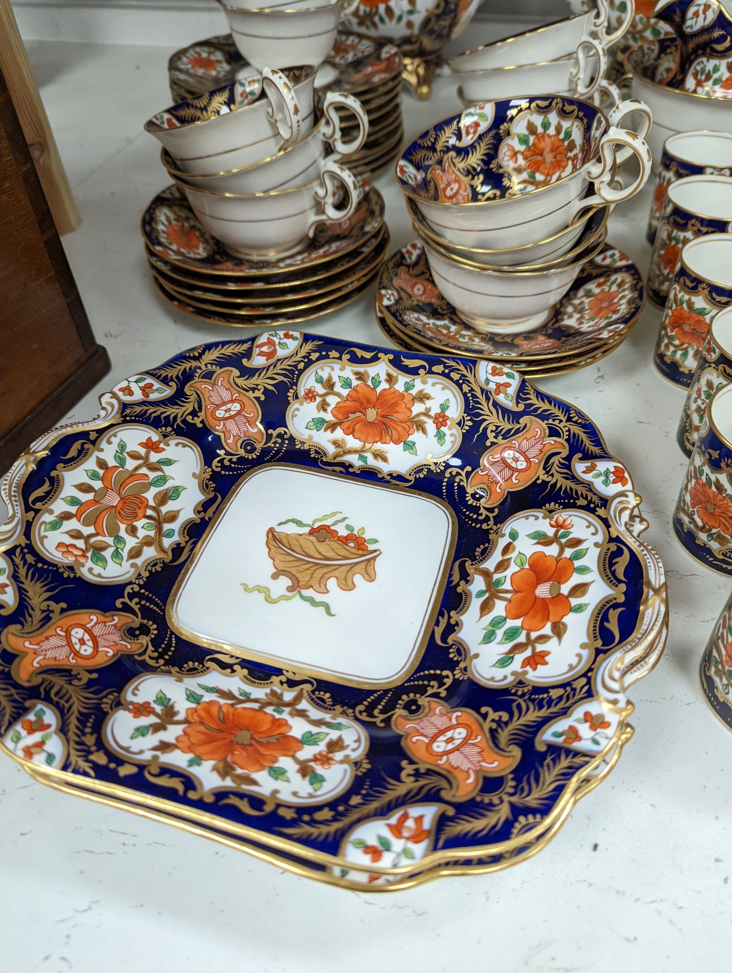 A mid 19th century English bone china fifty-two piece part tea and coffee service, decorated in an Imari pattern